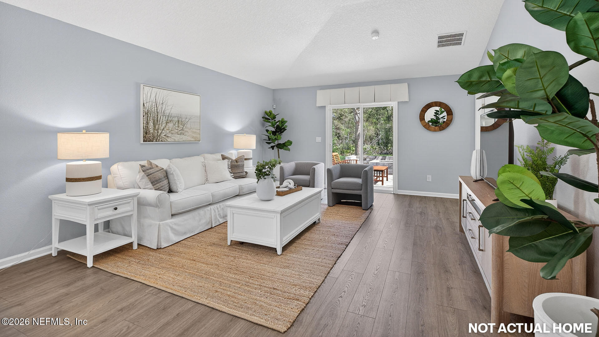 36 Divot Place Bunnell, FL 32110 - Photo 12 of 58 a living room with furniture and a wooden floor