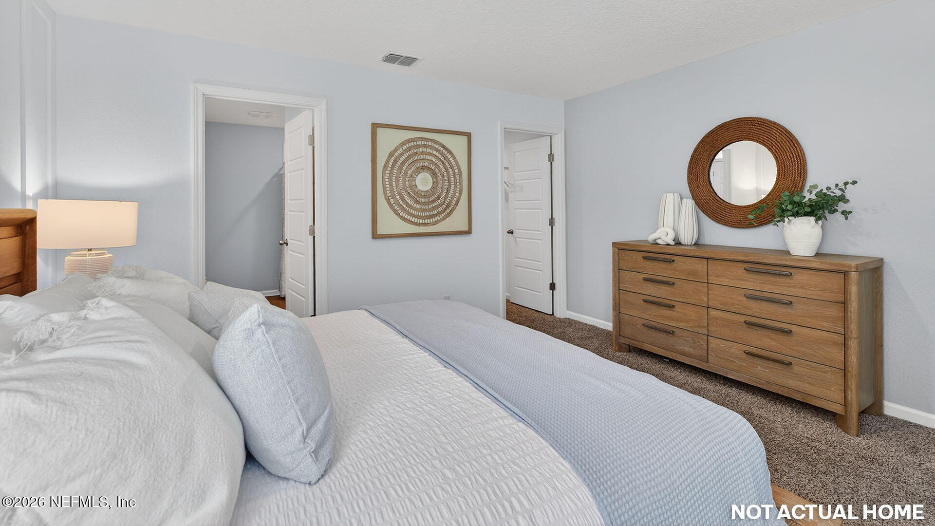 36 Divot Place Bunnell, FL 32110 - Photo 17 of 58 a bedroom with a bed and a dresser