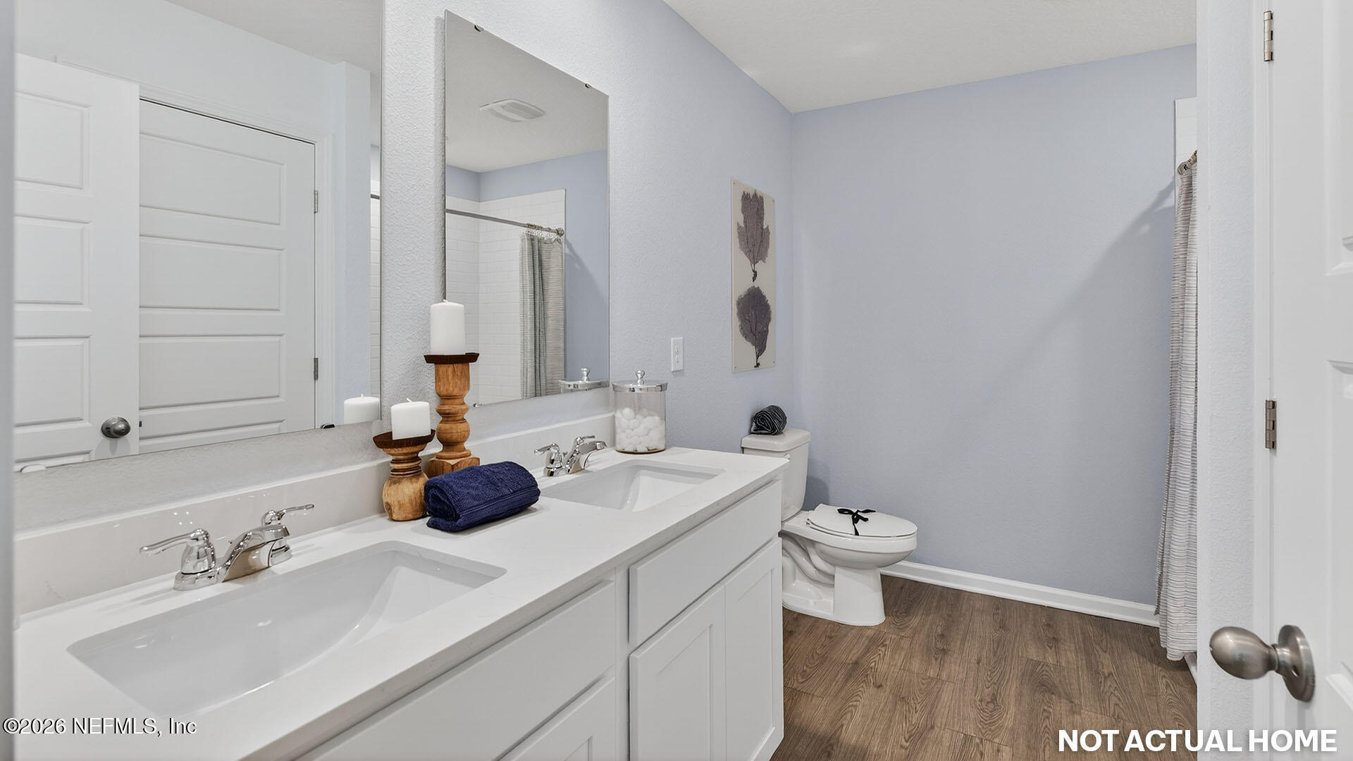 36 Divot Place Bunnell, FL 32110 - Photo 19 of 58 a bathroom with a double vanity sink toilet and mirror