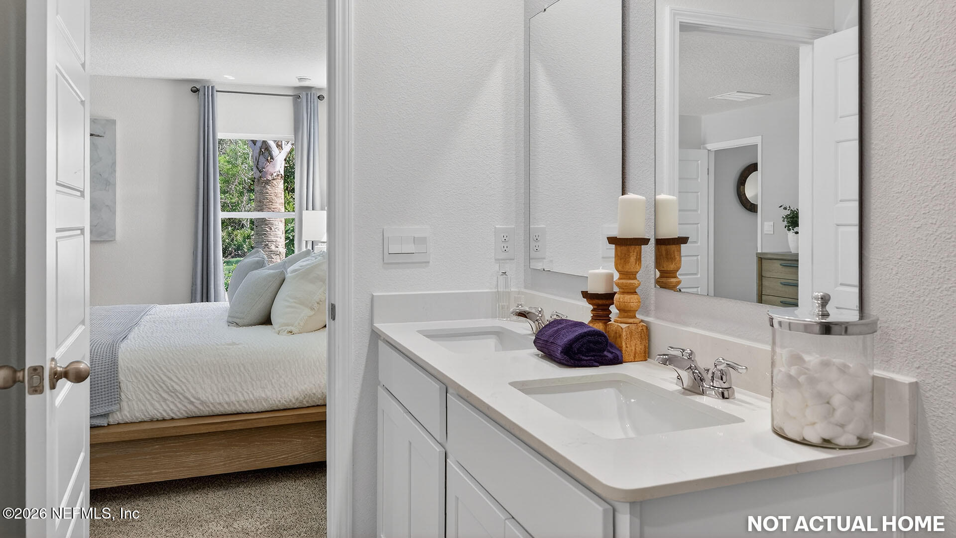 36 Divot Place Bunnell, FL 32110 - Photo 21 of 58 a bedroom with a bed and a mirror