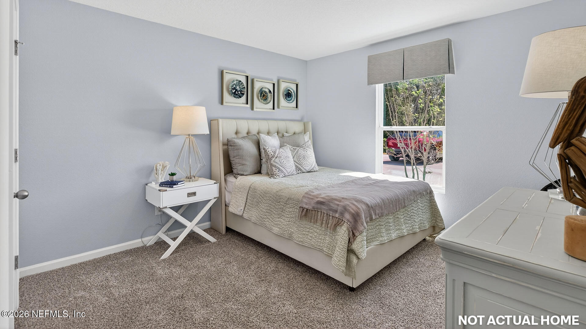 36 Divot Place Bunnell, FL 32110 - Photo 24 of 58 a bedroom with a bed and a table in it