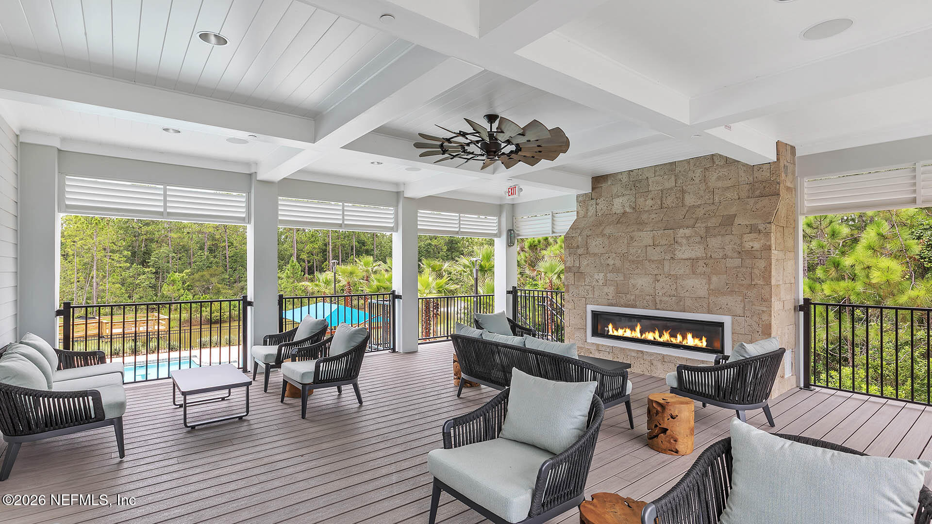 36 Divot Place Bunnell, FL 32110 - Photo 40 of 58 a living room with furniture and a floor to ceiling window