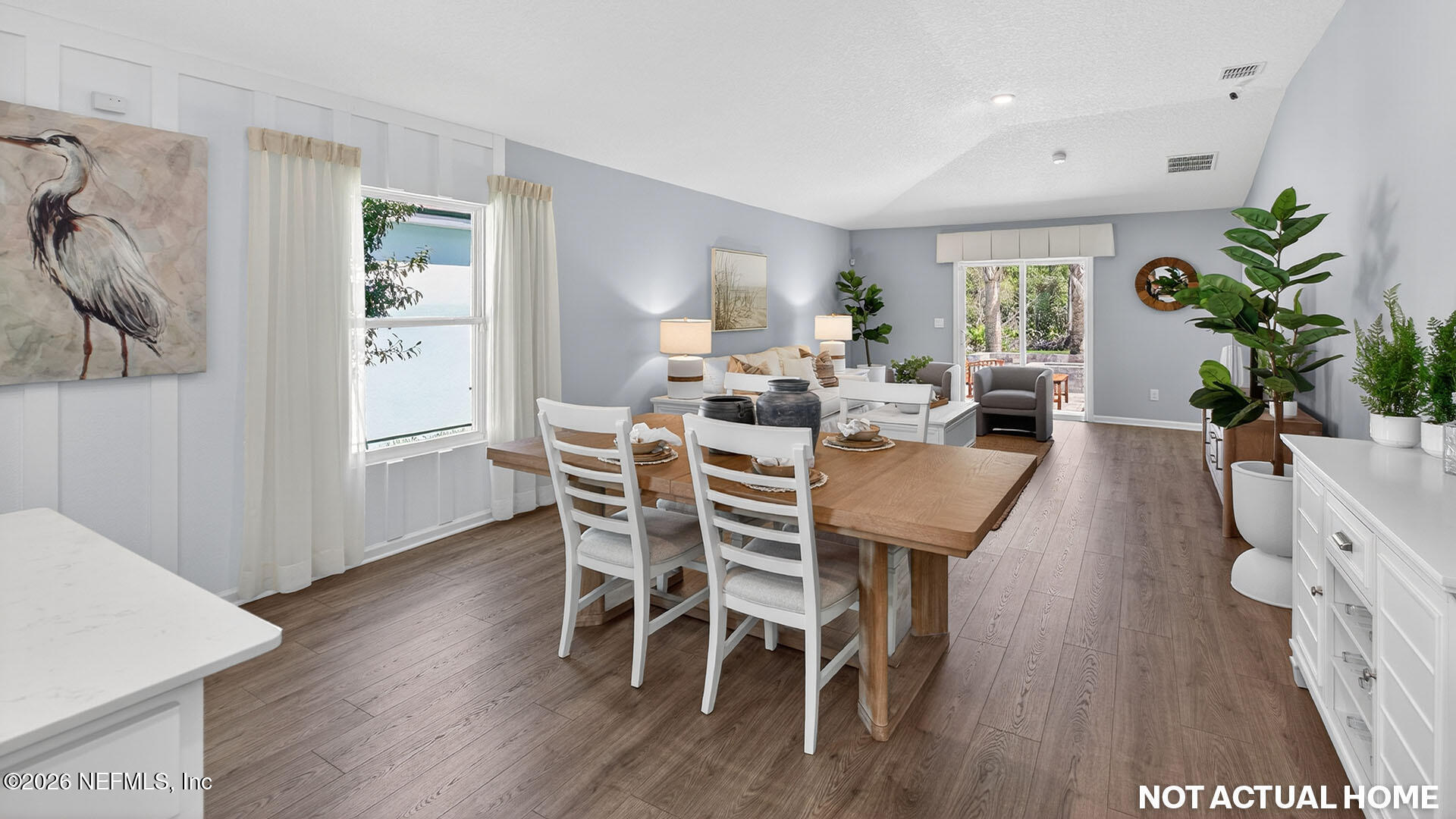 36 Divot Place Bunnell, FL 32110 - Photo 10 of 58 a view of a dining room with furniture window and wooden floor
