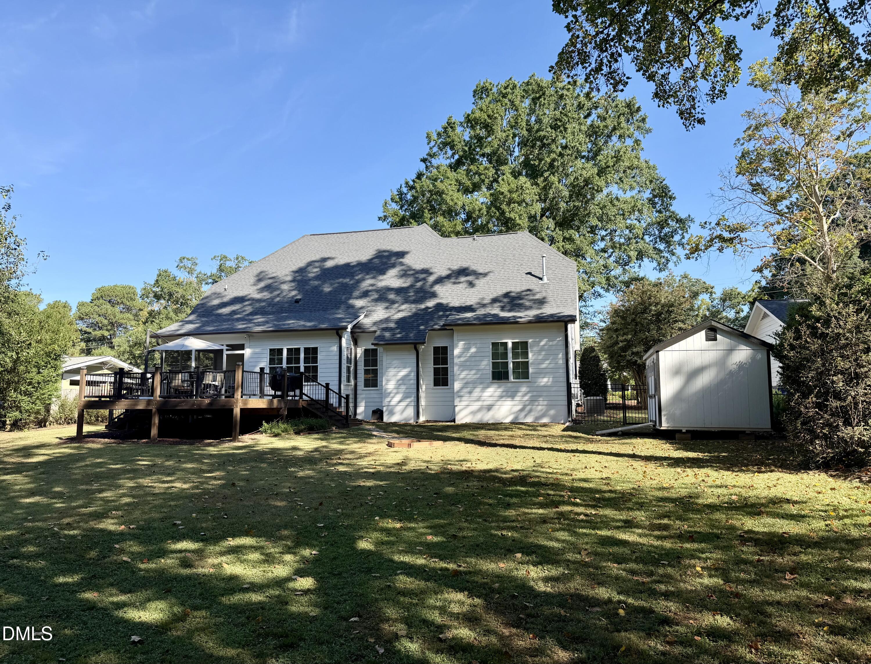 1404 Ivy Lane Raleigh, NC 27609 - Photo 2 of 37 Expansive backyard with a manicured lawn
