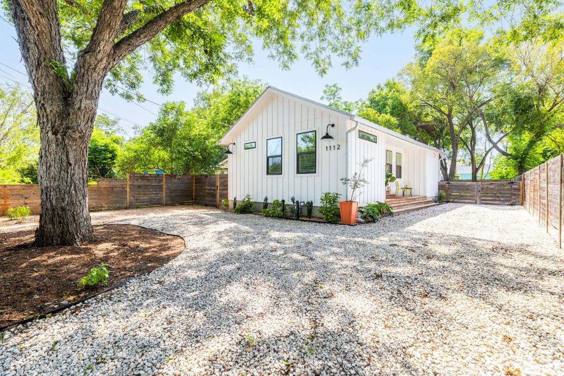 1112 Estes Avenue Austin, TX 78721 - Photo 1 of 1 a view of a house with backyard and a tree