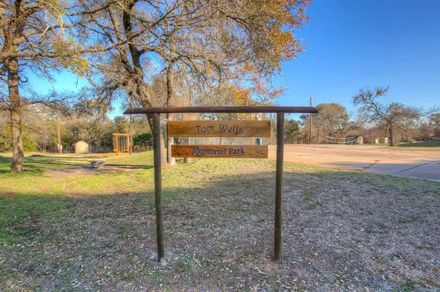 a view of yard with swimming pool and trees