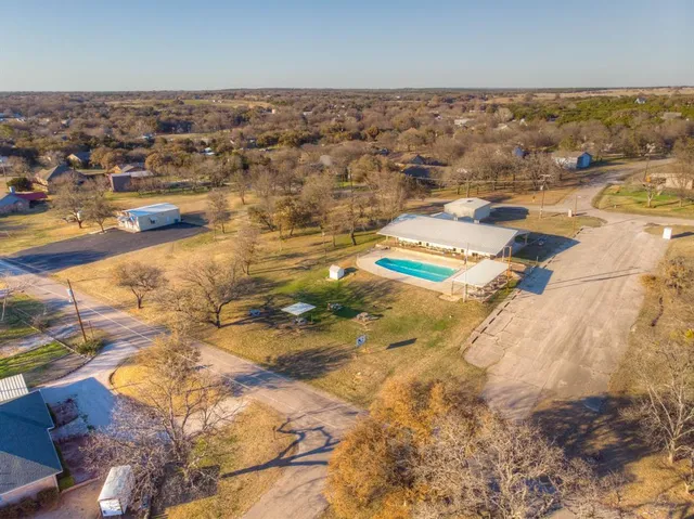 an aerial view of a house with outdoor space