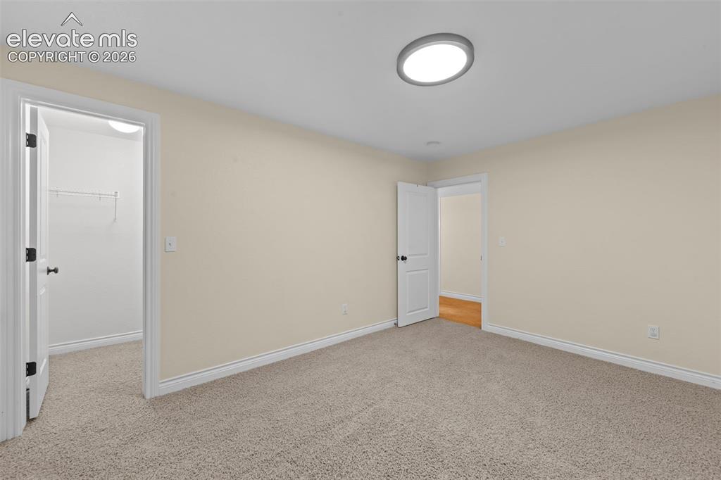 16540 Mesquite Road Peyton, CO 80831 - Photo 37 of 50 a view of an empty room with a window