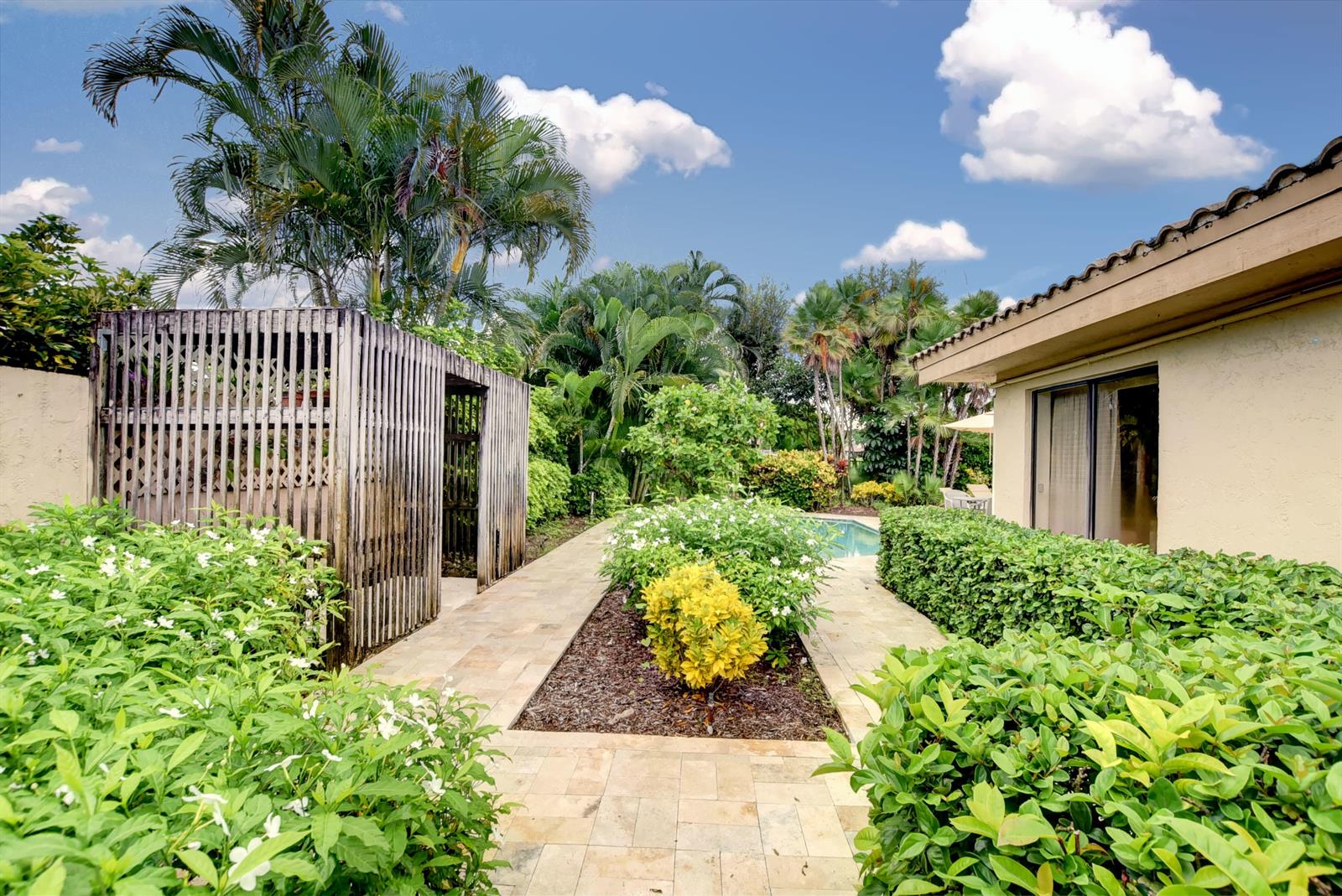 19508 Bay View Road Boca Raton, FL 33434 - Photo 44 of 77 Walkway toward pool area