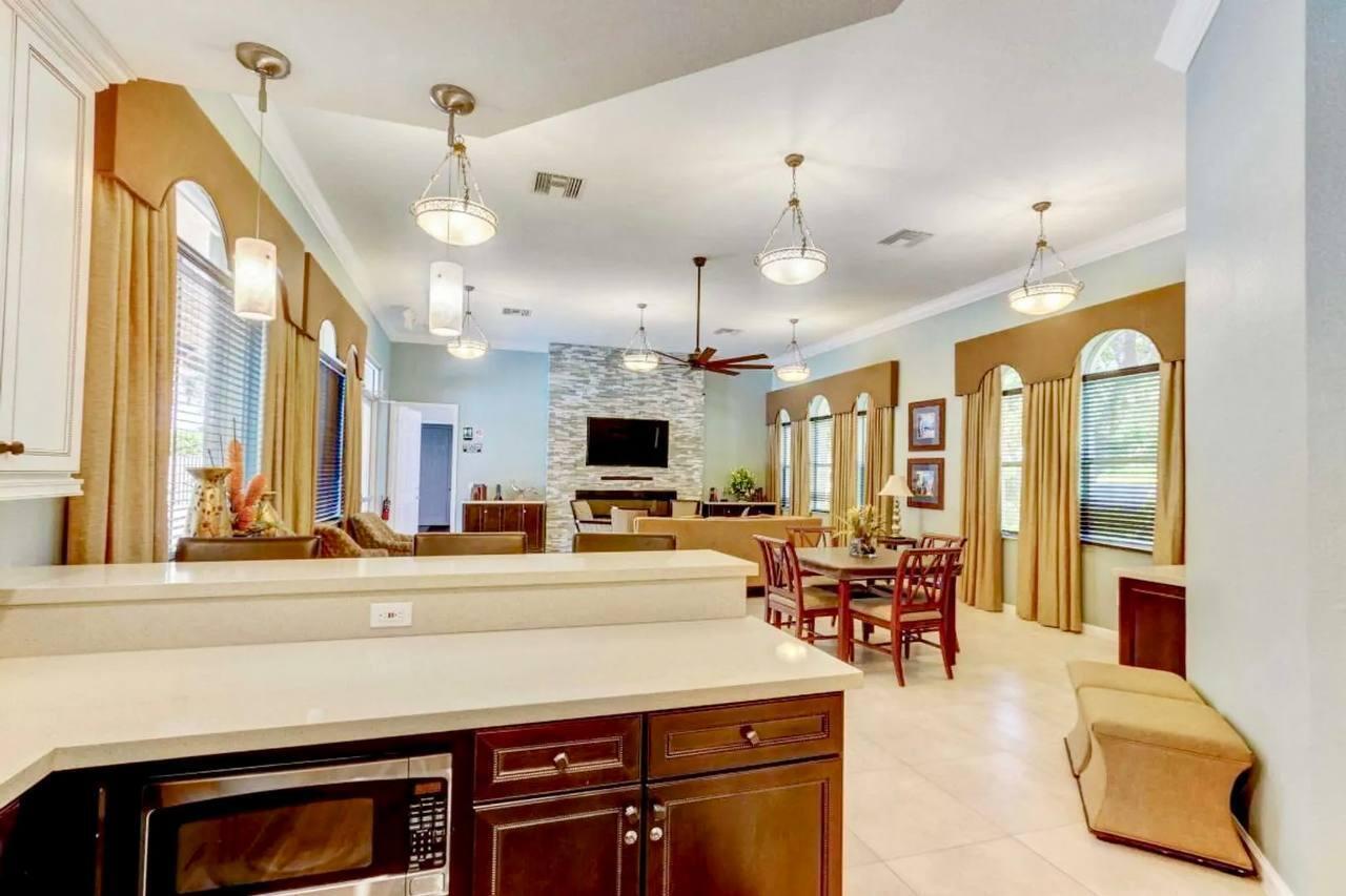 1067 Big Torch Street Riviera Beach, FL 33407 - Photo 21 of 23 a living room with furniture and large windows