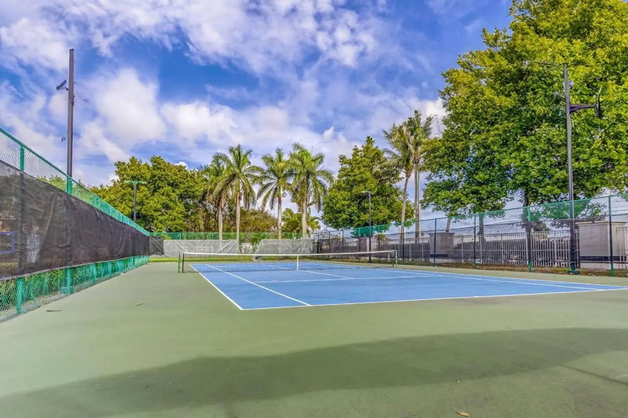 1067 Big Torch Street Riviera Beach, FL 33407 - Photo 22 of 23 a view of a tennis court
