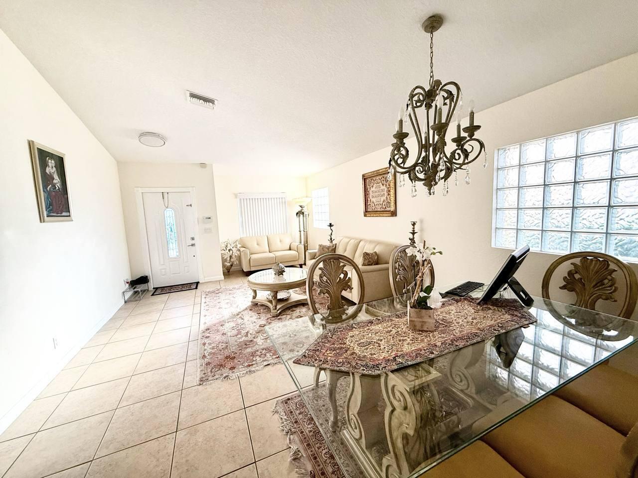 1067 Big Torch Street Riviera Beach, FL 33407 - Photo 6 of 23 a view of a dining room with furniture