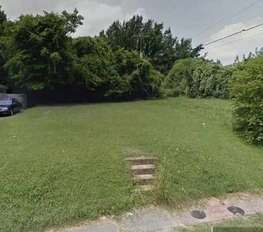 a view of a field with an outdoor space