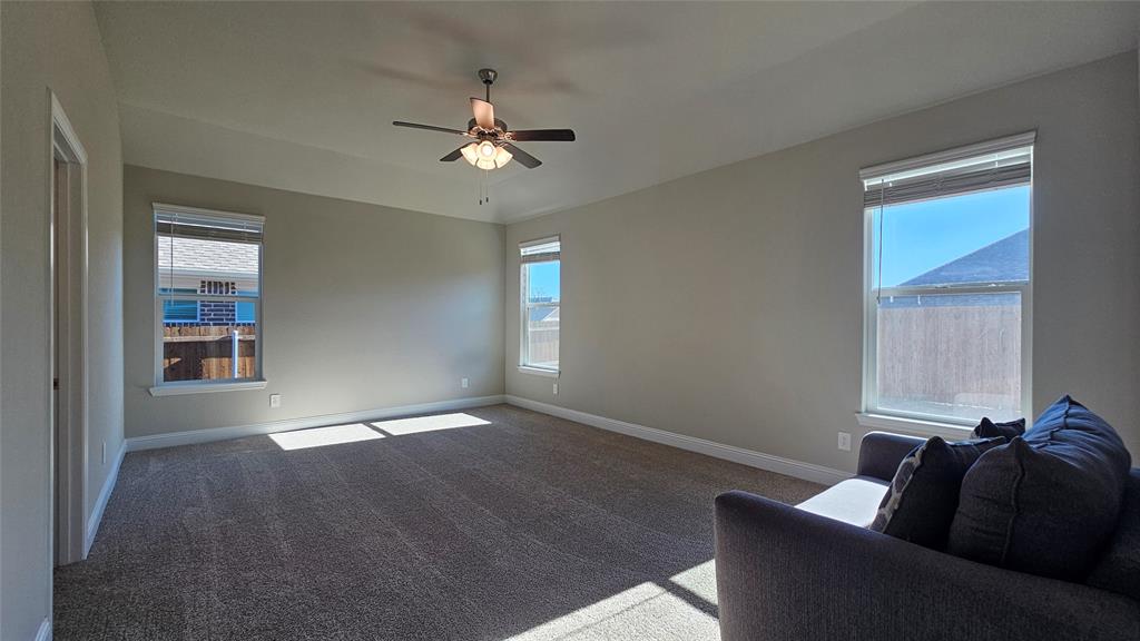 1405 Razorbill Road Denton, TX 76205 - Photo 18 of 40 a living room with furniture and a window