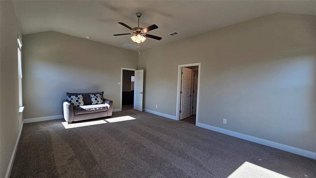 1405 Razorbill Road Denton, TX 76205 - Photo 19 of 40 a living room with furniture and chandelier