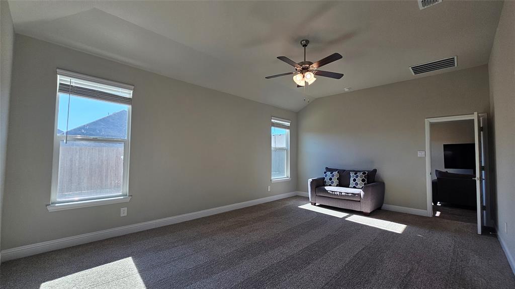 1405 Razorbill Road Denton, TX 76205 - Photo 20 of 40 a view of a livingroom with a piano and wooden floor