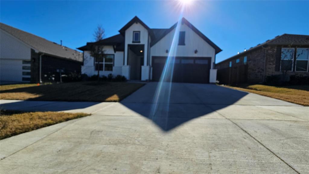 1405 Razorbill Road Denton, TX 76205 - Photo 2 of 40 a front view of a house with a yard