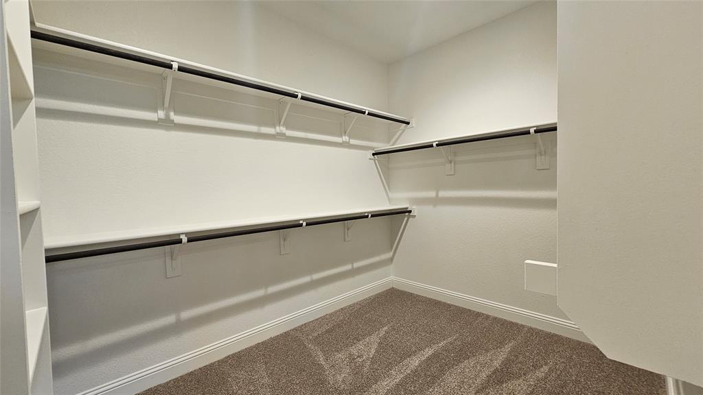 1405 Razorbill Road Denton, TX 76205 - Photo 23 of 40 a view of an empty walk in closet