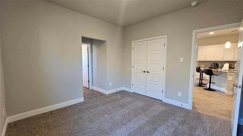 1405 Razorbill Road Denton, TX 76205 - Photo 29 of 40 an empty room with mirror and a bathroom