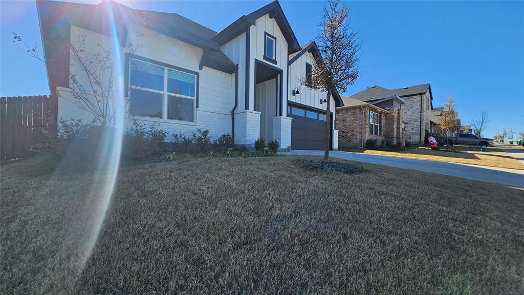 1405 Razorbill Road Denton, TX 76205 - Photo 3 of 40 a view of a house with a yard