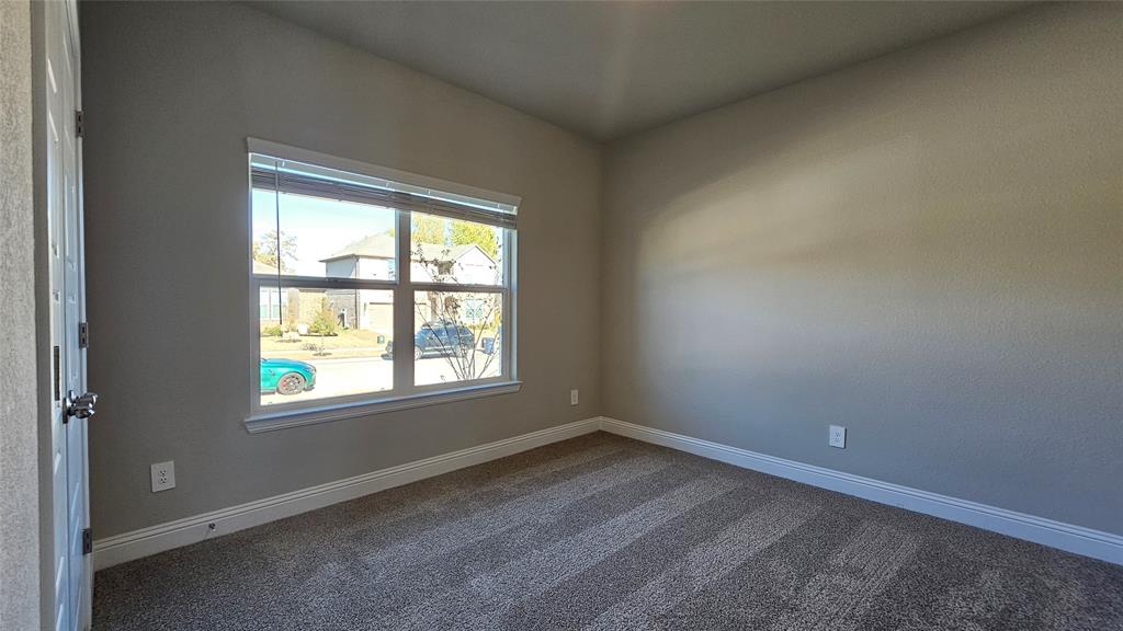 1405 Razorbill Road Denton, TX 76205 - Photo 33 of 40 an empty room with a window
