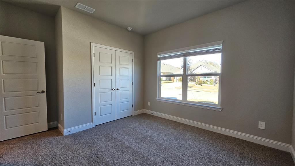 1405 Razorbill Road Denton, TX 76205 - Photo 34 of 40 an empty room with windows