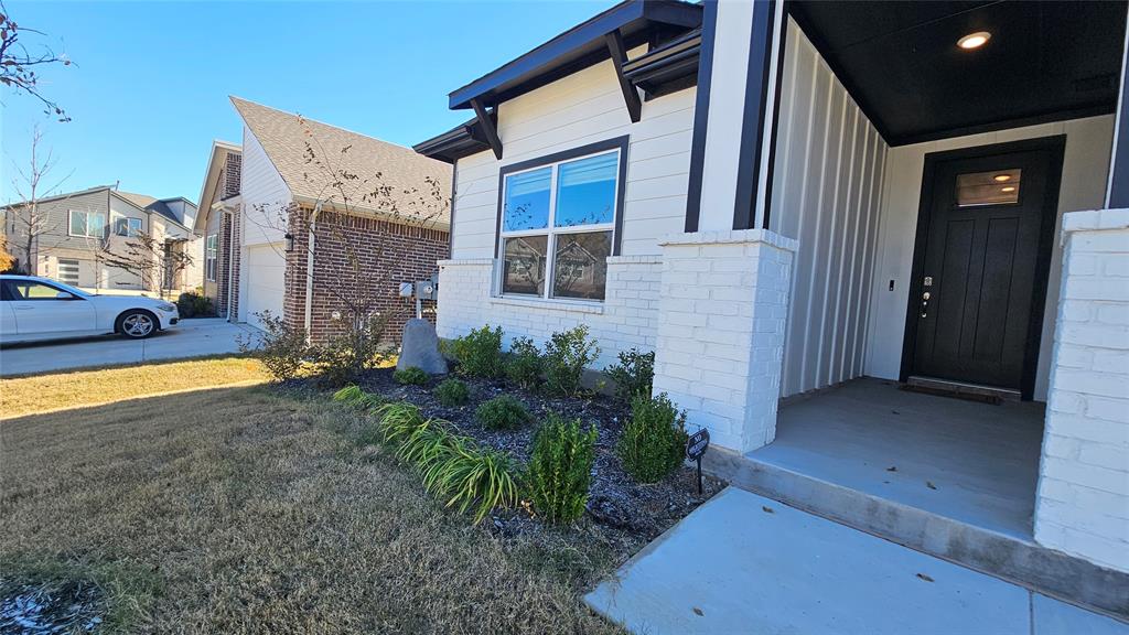 1405 Razorbill Road Denton, TX 76205 - Photo 4 of 40 a view of an house with backyard and garden