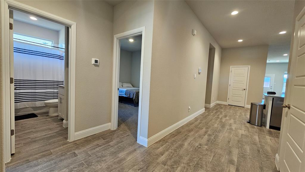 1405 Razorbill Road Denton, TX 76205 - Photo 7 of 40 wooden floor in a hall with an entryway