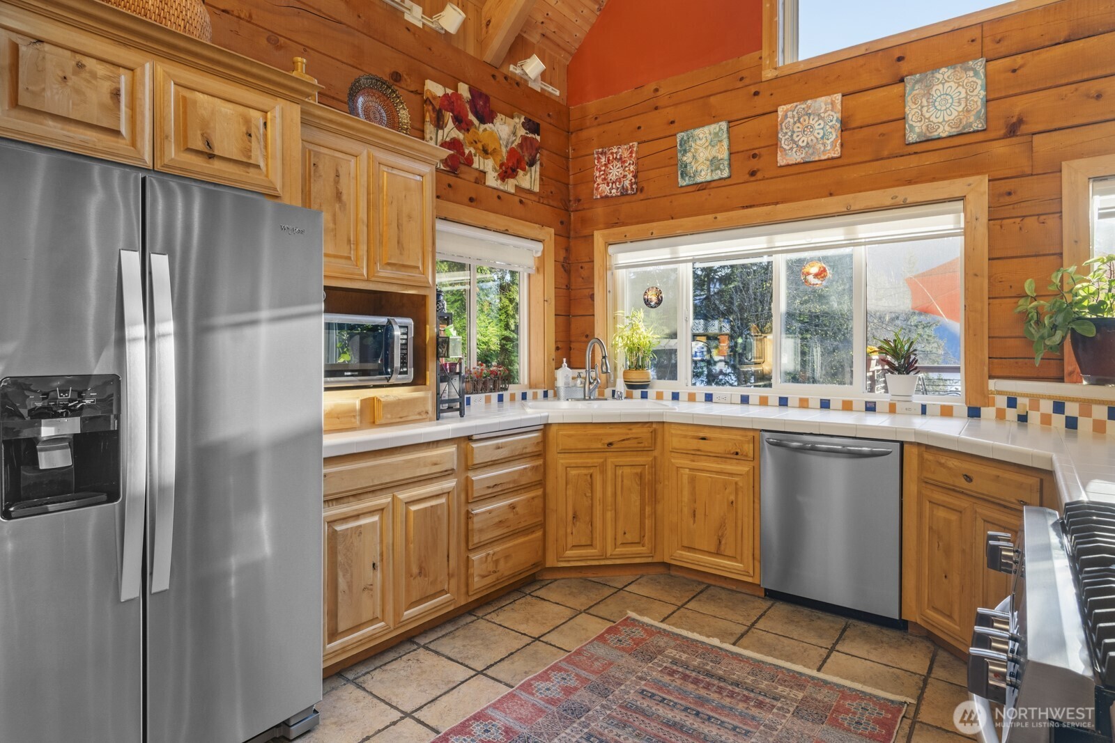 6323 North Lake Cushman Road Hoodsport, WA 98548 - Photo 18 of 40 a kitchen with stainless steel appliances granite countertop a sink and cabinets