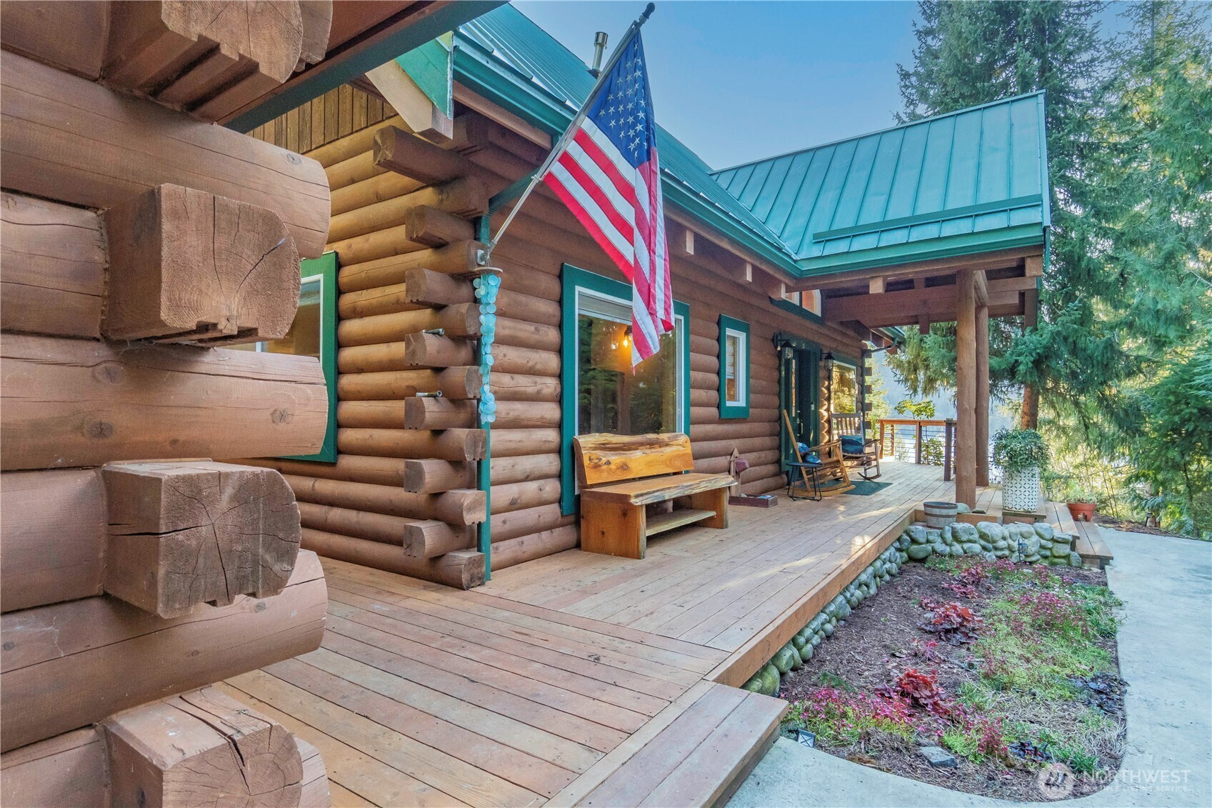 6323 North Lake Cushman Road Hoodsport, WA 98548 - Photo 2 of 40 a backyard of a house with barbeque oven table and chairs