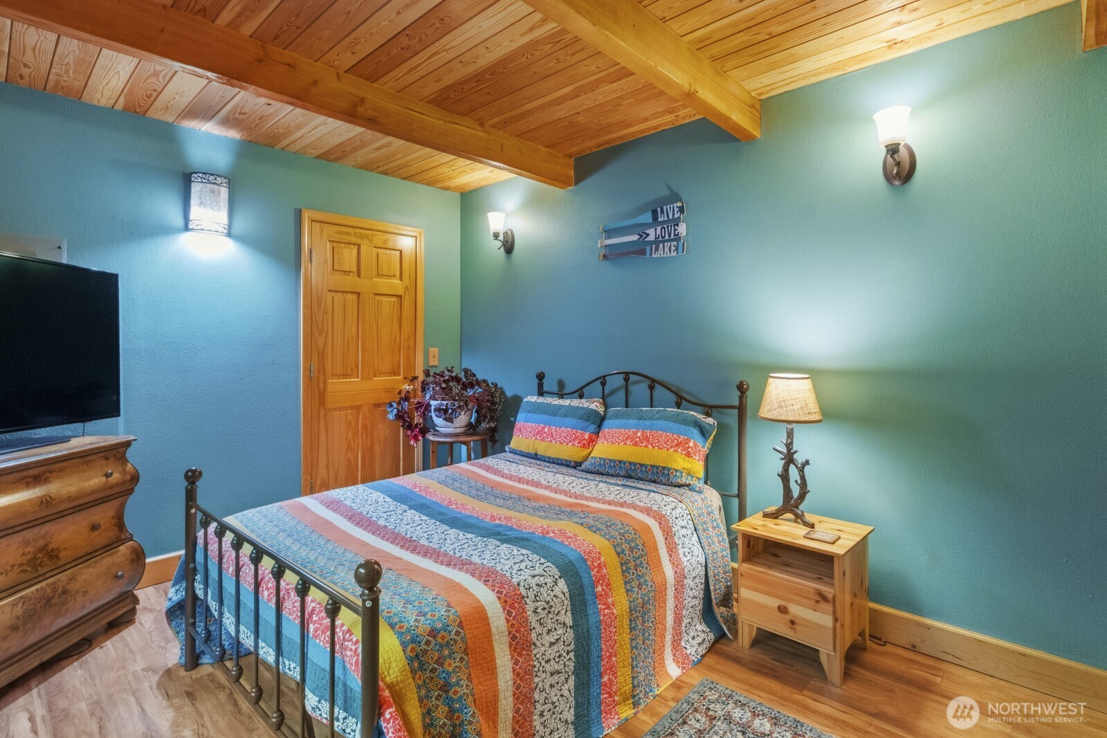 6323 North Lake Cushman Road Hoodsport, WA 98548 - Photo 21 of 40 a bedroom with a bed and a television