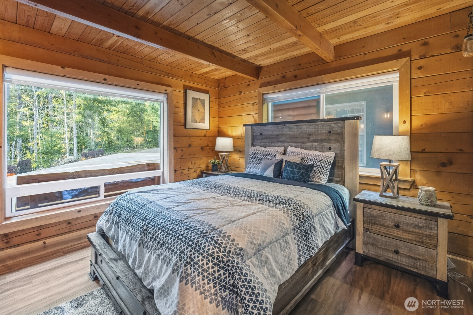 6323 North Lake Cushman Road Hoodsport, WA 98548 - Photo 22 of 40 a bedroom with a bed and a large window