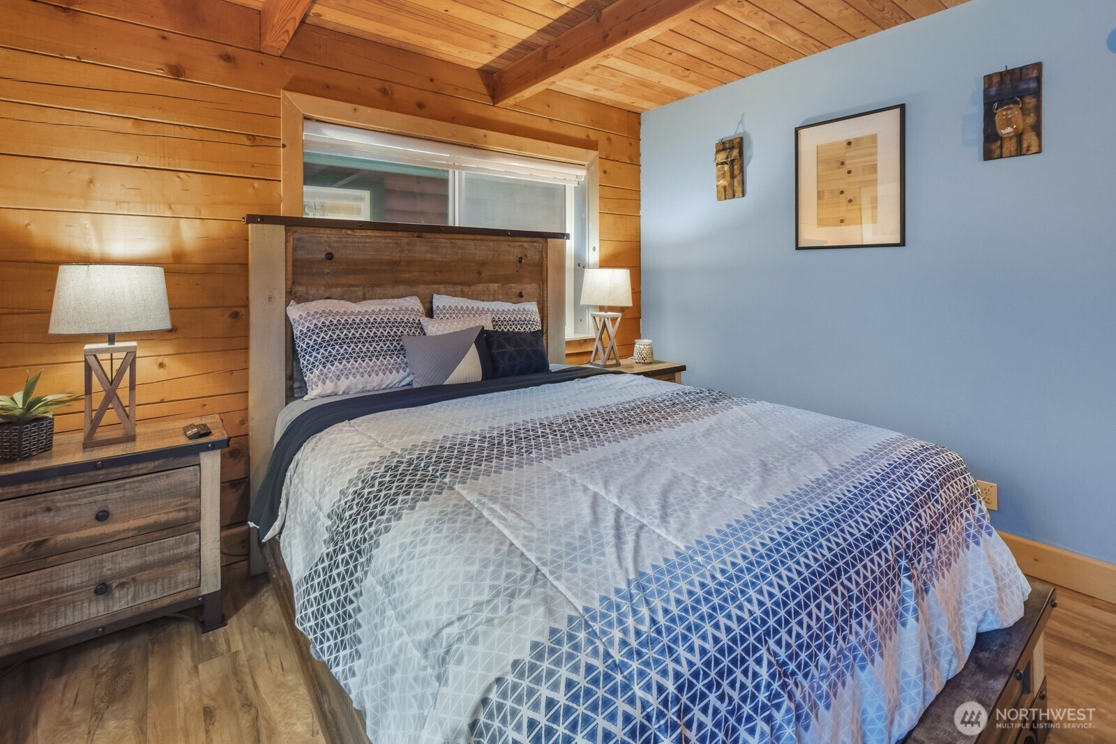 6323 North Lake Cushman Road Hoodsport, WA 98548 - Photo 23 of 40 a bedroom with a bed and a lamp