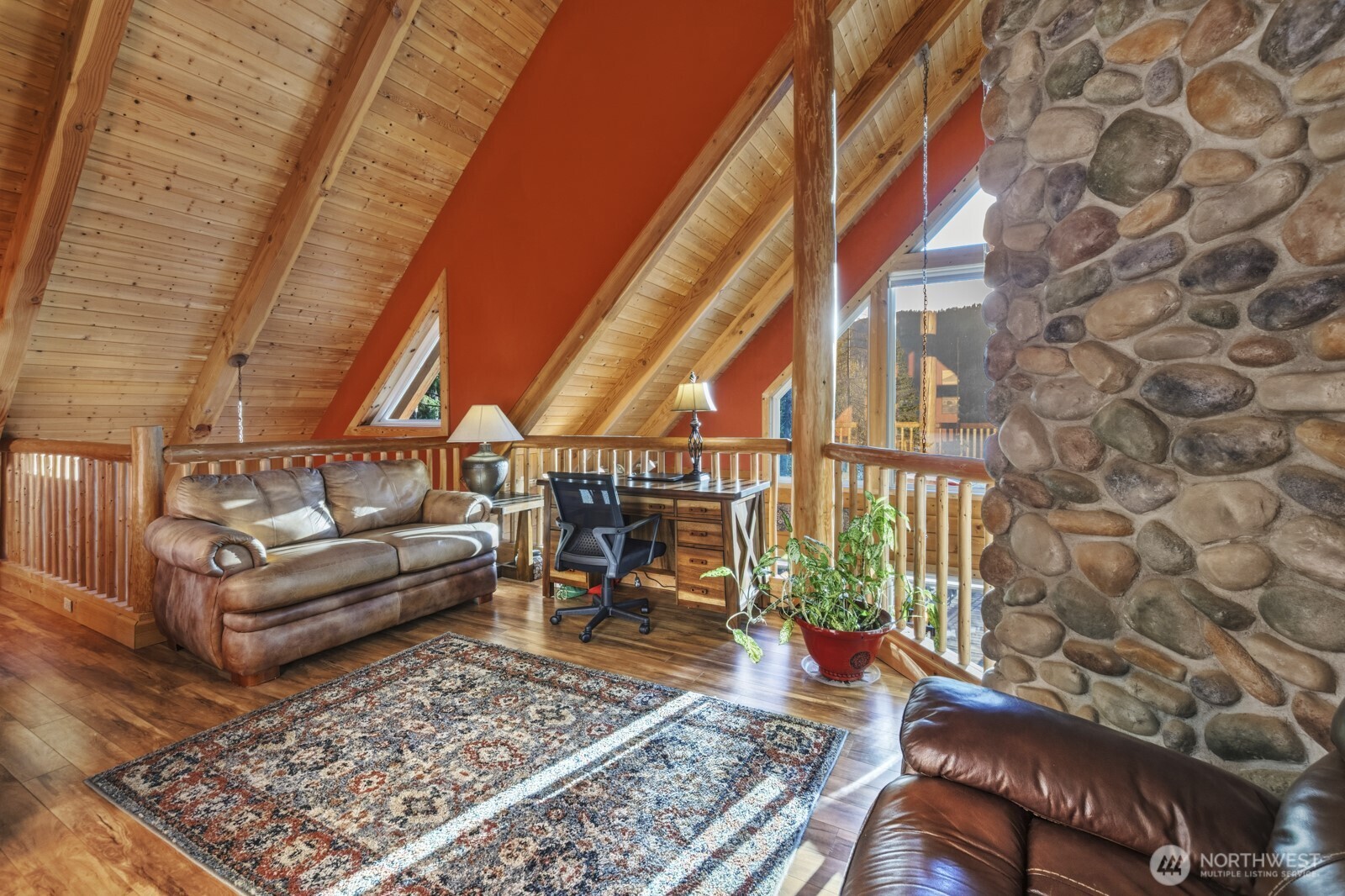 6323 North Lake Cushman Road Hoodsport, WA 98548 - Photo 26 of 40 a living room with furniture and a rug
