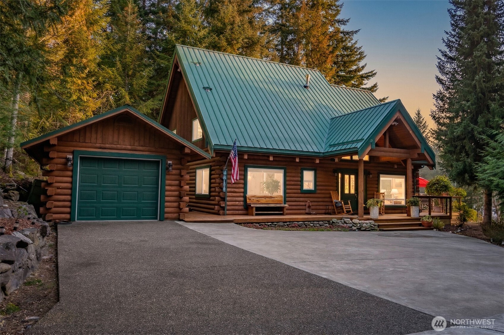 6323 North Lake Cushman Road Hoodsport, WA 98548 - Photo 3 of 40 a front view of a house with garden