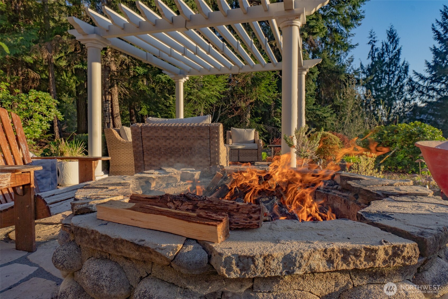 6323 North Lake Cushman Road Hoodsport, WA 98548 - Photo 34 of 40 a view of an outdoor sitting area with brick wall