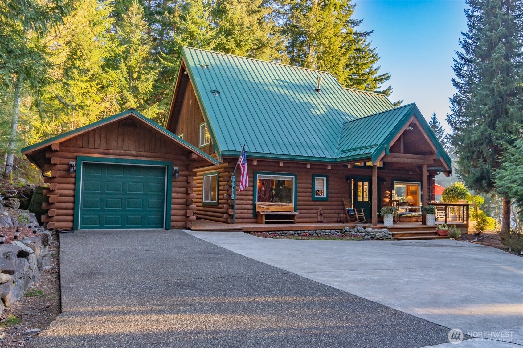 6323 North Lake Cushman Road Hoodsport, WA 98548 - Photo 37 of 40 a front view of a house with garage