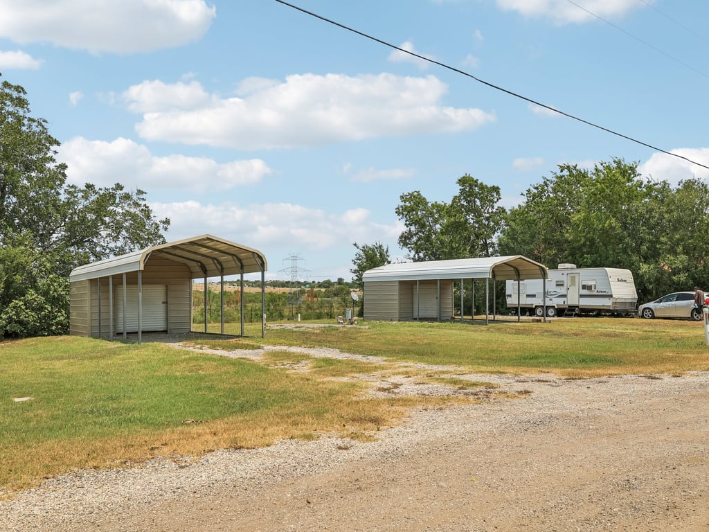 Tbd Tbd Bluebonnet Road Lockhart, TX 78644 - Photo 10 of 20 a front view of a house with a garden
