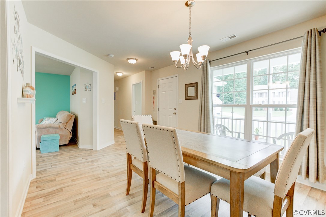 9607 Gdn Rdg Trace Chesterfield, VA 23832 - Photo 8 of 25 a view of a dining room with furniture window and wooden floor