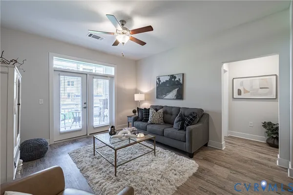 a living room with furniture and a window