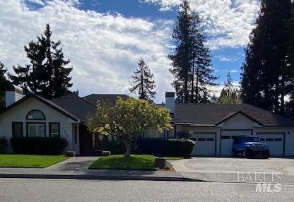 7990 Mitchell Court Sebastopol, CA 95472 - Photo 1 of 1 a front view of a house with a yard and garage