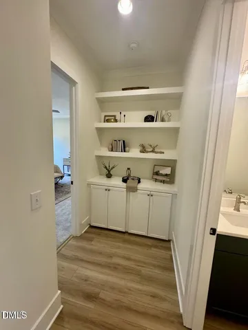 a view of utility room with racks on the wall