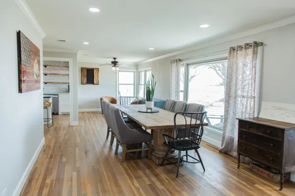 a view of a dining room with furniture window and outside view