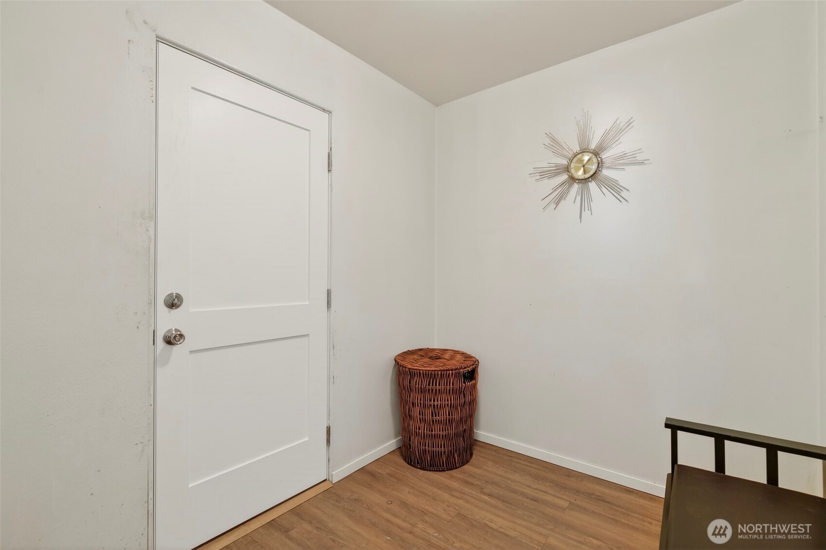 312 Southeast 2nd Street Winlock, WA 98596 - Photo 13 of 40 a view of an empty room with wooden floor and fan
