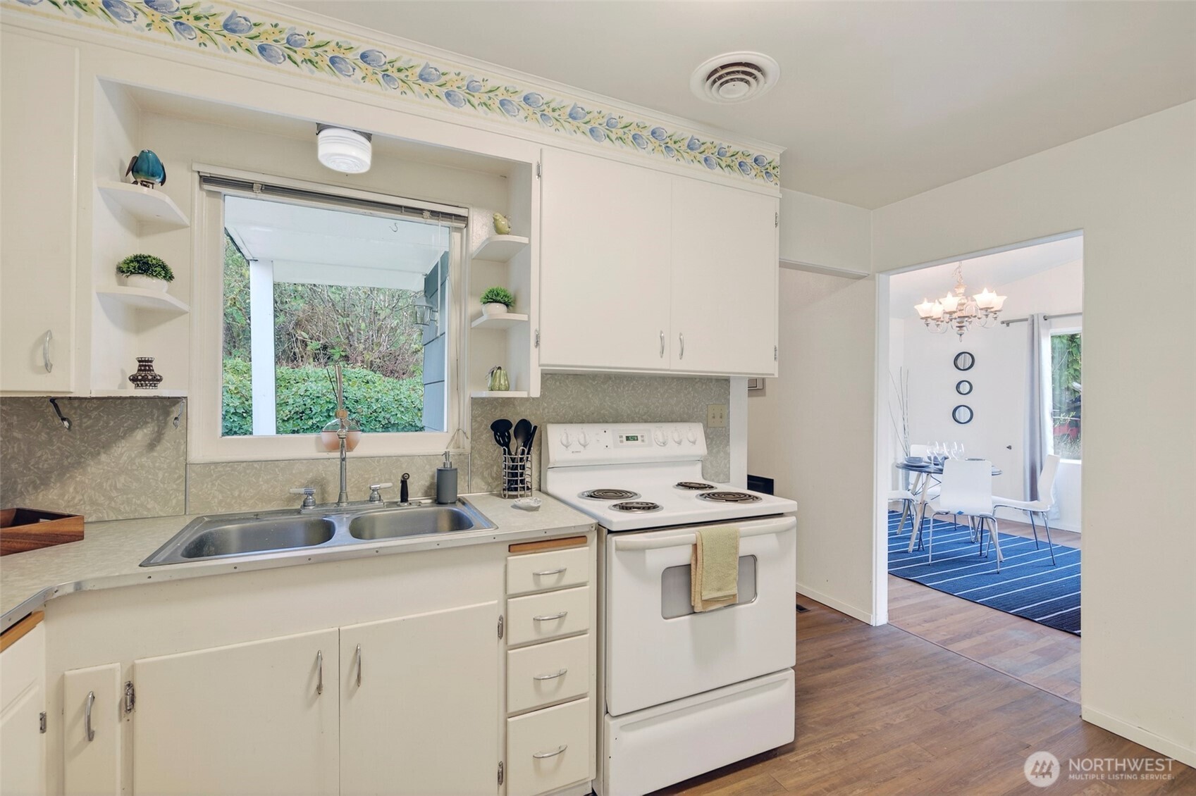 312 Southeast 2nd Street Winlock, WA 98596 - Photo 15 of 40 a kitchen with a sink a stove and cabinets