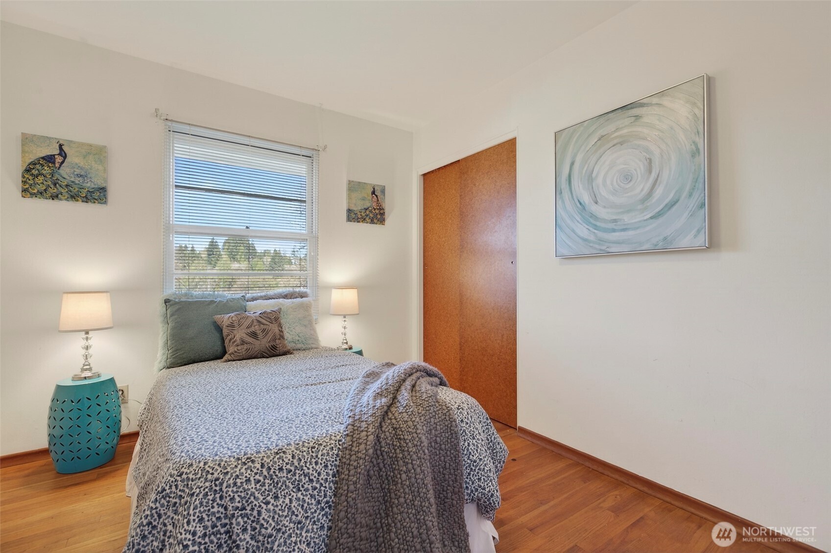 312 Southeast 2nd Street Winlock, WA 98596 - Photo 18 of 40 a bedroom with a bed and a painting on the wall