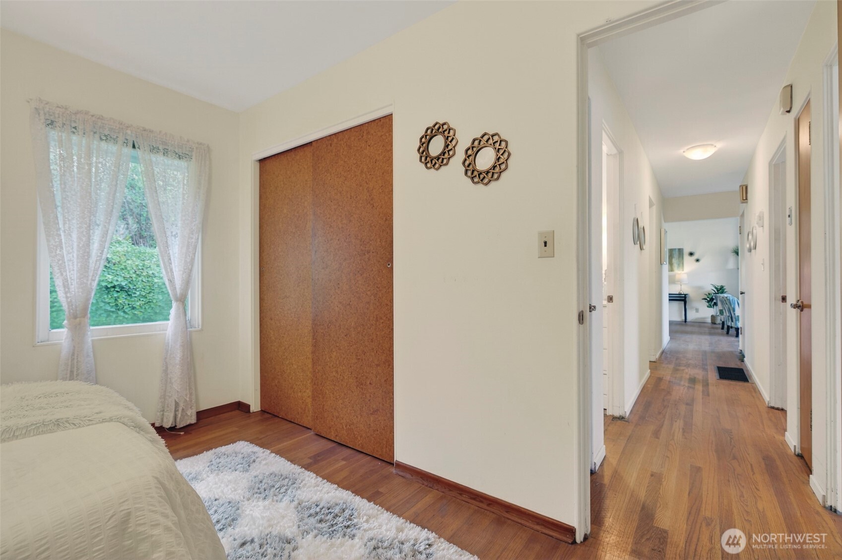 312 Southeast 2nd Street Winlock, WA 98596 - Photo 24 of 40 a view of a bedroom with wooden floor and a window