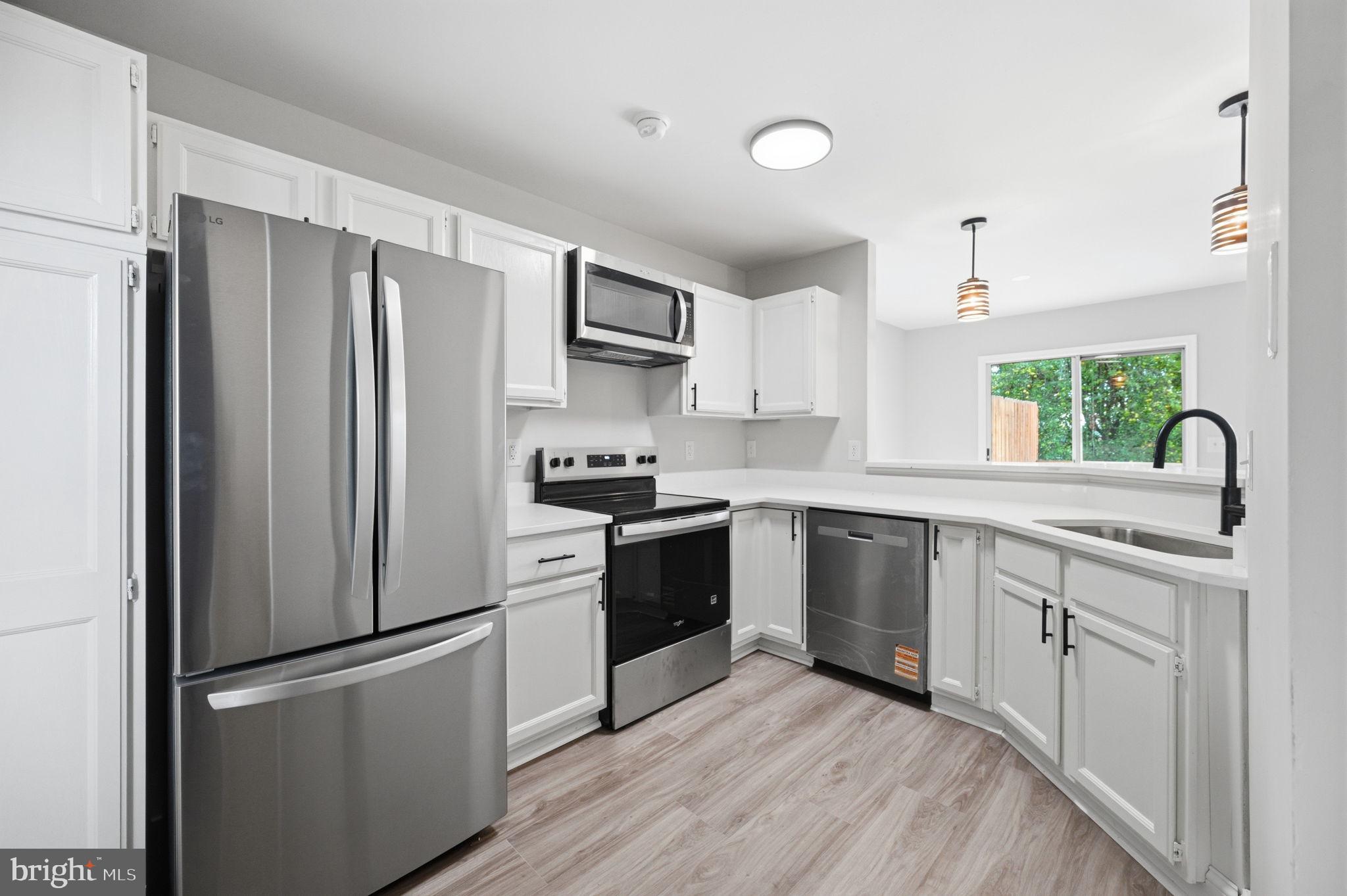 672 Ripplebrook Drive Culpeper, VA 22701 - Photo 13 of 26 Modern kitchen with sleek finishes.