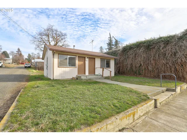 a view of a backyard with a garden