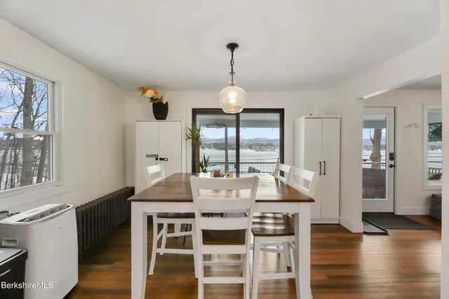 a view of a dining room with furniture window and wooden floor